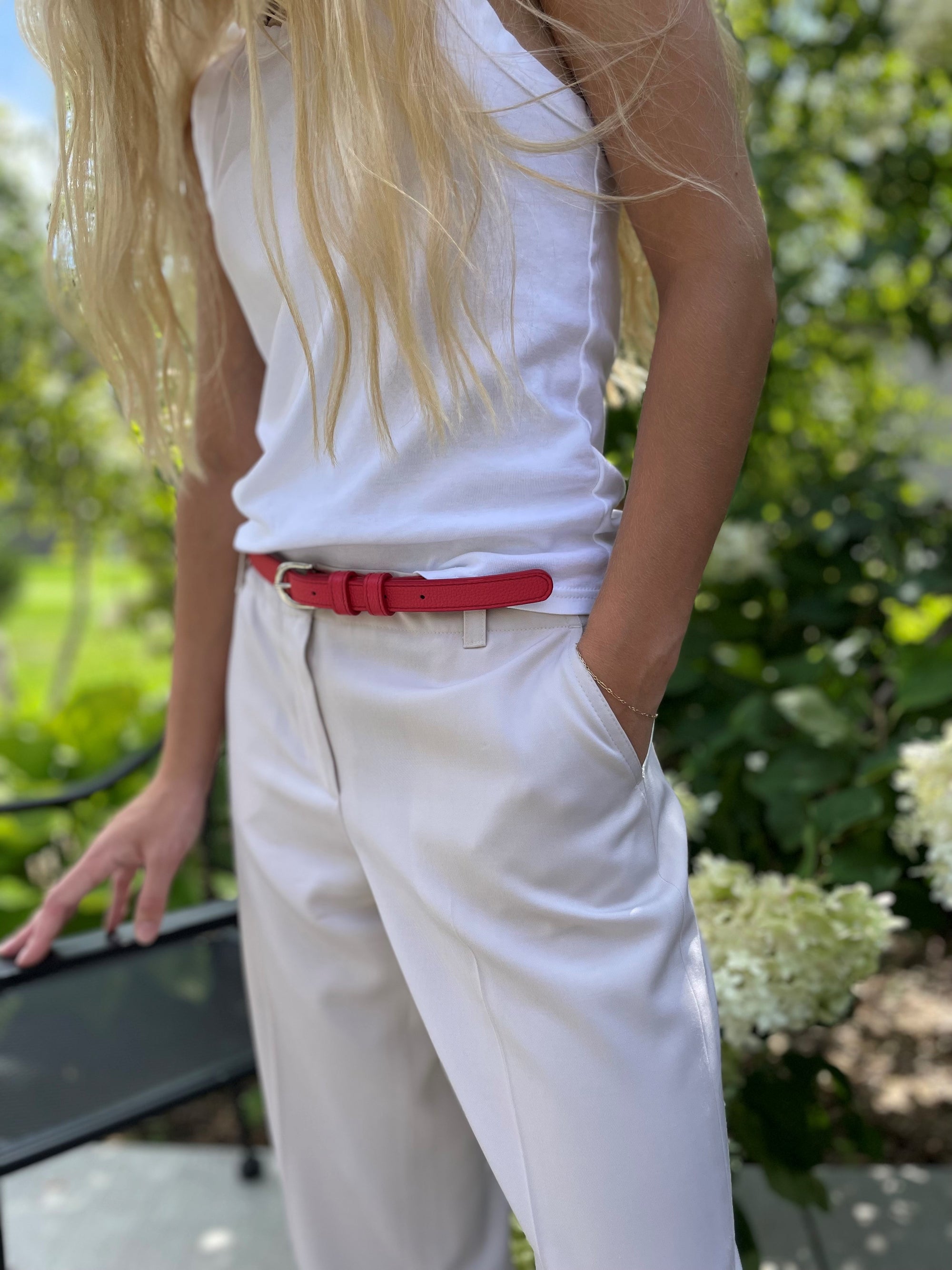 Red belt on white/tan outfit